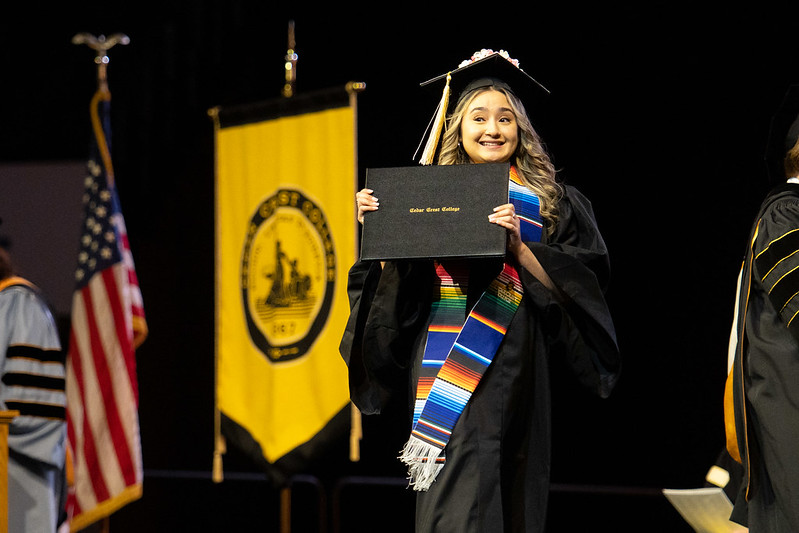 Graduate Crosses the stage at Commencement