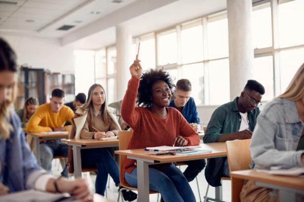 Happy student raising arm to answer question