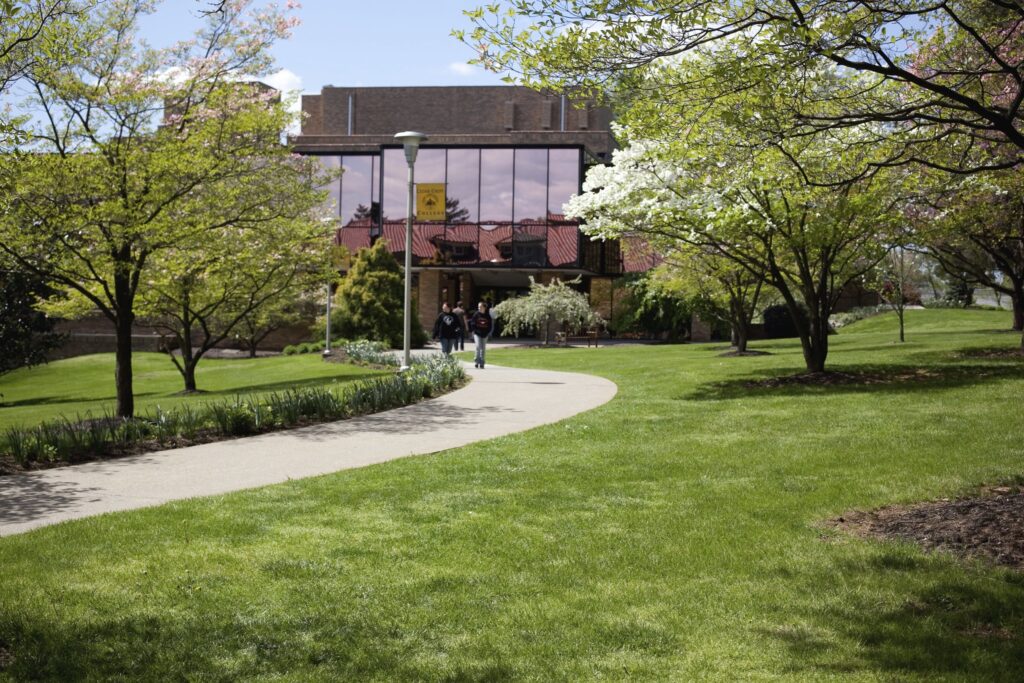 Students walk outside on the Cedar Crest College Campus