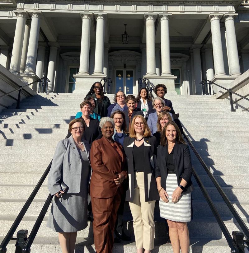 President Meade and other women of the Women's College Coalition standing outside the Senate