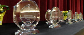 Glass awards inscribed with the Cedar Crest College crest