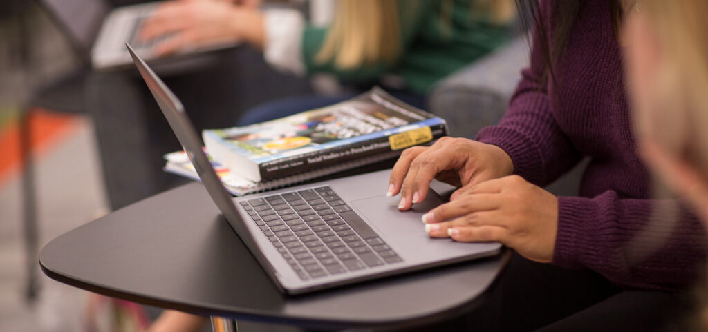 SAGE Student at a laptop