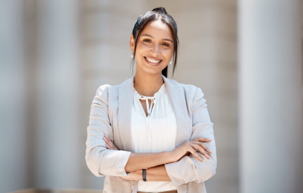 City business woman, portrait and smile for corporate success, motivation and vision in urban New York USA outdoors. Happy young female entrepreneur, employee and worker with vision of career goals